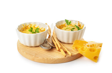 Ramekins with tasty julienne and ingredients on white background
