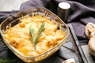 Baking dish with tasty julienne on table, closeup
