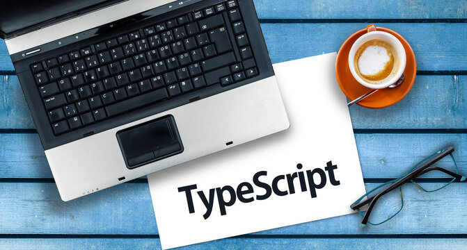 TypeScript Programming Language. Word TypeScript on paper and laptop
