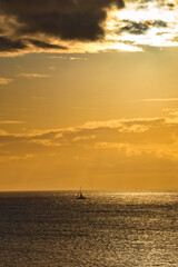 Sailboat on the ocean during sunset 