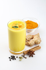Golden milk with milk, turmeric, cinnamon, ginger ,black pepper, honey for healthy drink