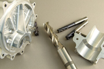 four cutters for metal processing. carbide tool. parts made with this tool lie next to each other