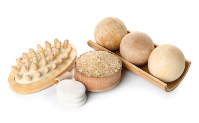 Composition with sea salt, massage balls, brush and spa stones on white background