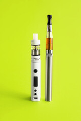 Vape mod with electronic cigarette on color background