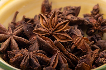 Star anise in a vintage ceramic bowl