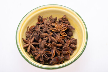 Star anise in a vintage ceramic bowl
