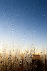 Fototapeta na wymiar Close up of condensation on a window.