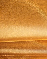 Golden organza fabric with beautiful pleats. Solid satin, satin background.