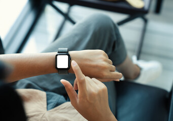 woman using smartwatch blank screen on top view