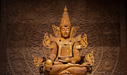 wood land Buddha statue carved in real wood.