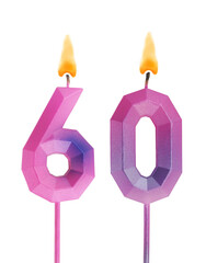 Pink and blue burning birthday candles isolated on white background, number 60