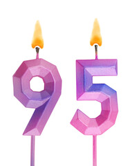 Pink and blue burning birthday candles isolated on white background, number 95