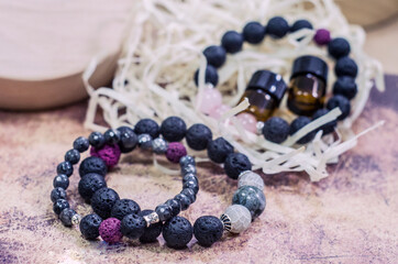 Bracelet made of lava with natural stones. Handmade jewelry bottle with essential oils.
