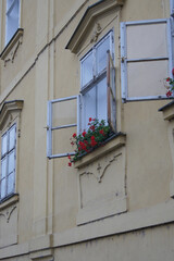 Fototapeta na wymiar An old window overlooks a quiet street in autumn 