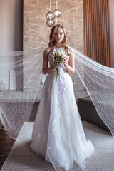 bride in fancy dress. wedding dress with long arms. dark interior