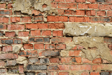 Old weathered brick wall fragment .