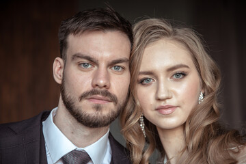 large portrait of a man and a woman. portrait of the groom and bride
