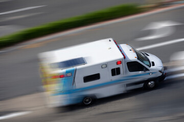 Fototapeta na wymiar An ambulance races to respond to the scene of an emergency.