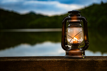 Light an oil lantern by the lake.
