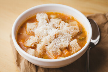 ribollita bowl of soup with a spoon