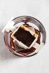 Drip coffee bag in a mug. Trends in brewing coffee at home.