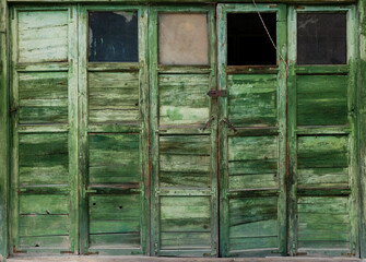 old wooden doors in green color
