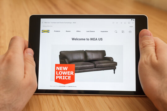 SAN FRANCISCO, US - 1 April 2019: Close up to hands holding tablet using internet and looking through IKEA US web site, in San Francisco, California, USA. An illustrative editorial image.