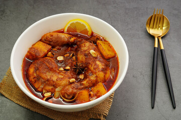 Homemade Massaman Chicken with Chili Paste, Coconut Milk and onions