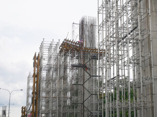 SEREMBAN, MALAYSIA -AUGUST 1, 2020: The concrete pillar structure is under construction at the construction site. The mold uses timber formwork and is temporarily supported with scaffolding.