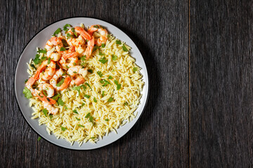 Lime shrimps with rice top view, copy space