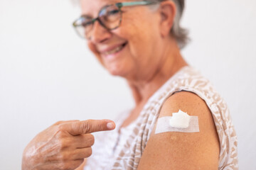 Smiling senior woman 70s after receiving the coronavirus covid-19 vaccine.