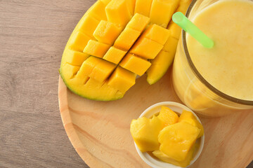Mango juice with milk and portions of fruit top detail