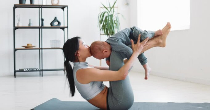 Mom and child do fitness at home during isolation