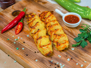 Potato Kebab With Hot Sauce On The Wooden Tray