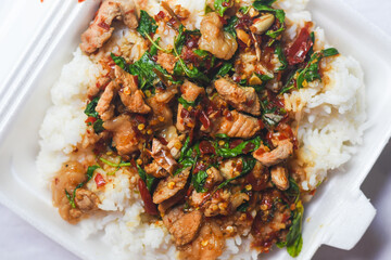Rice topped with stir-fried pork and basil.