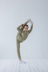Young beautiful cool looking girl posing in studio