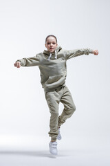 Young beautiful cool looking girl posing in studio