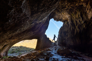 Female hiker exploring caves