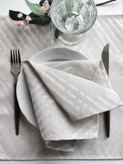 table setting. napkins and cutlery. natural fabrics.