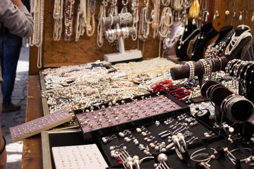 Bracelets, rings, earrings and necklaces made from Ohrid pearls are sold in the market. Lots of feminine jewelry, background