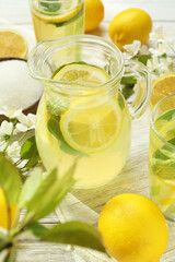 Concept of fresh summer drink with lemonade on white wooden table