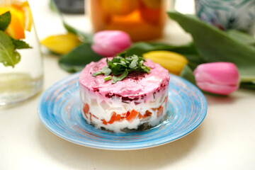 Obraz na płótnie Canvas Herring salad with beetroots. Traditional dish. A colorful appetizing dish. Culinary photography, food styling.