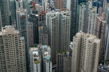 Obraz premium Arial view of high rise and skyscrapers building in Victoria harbor area, Hong Kong, China.