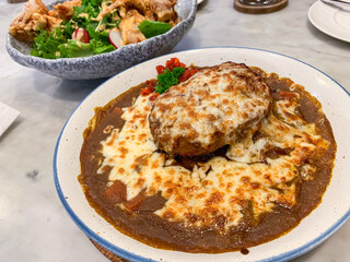 Japanese hamburg curry rice with mozzarella cheese - close up