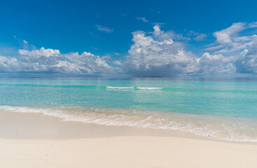 Fototapeta na wymiar Paradise white sand beach and turquoise water in nice summer day, Gulhi Island, Maldives