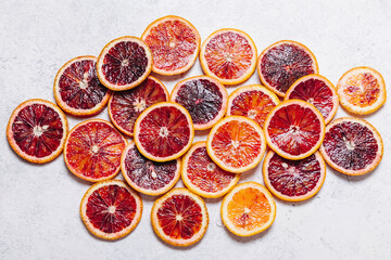 Fresh ripe sliced blood oranges on white background. Top view, flat lay. Blood orange texture...