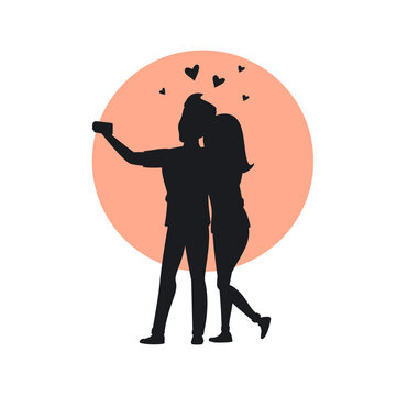 silhouette of a couple in love taking selfie