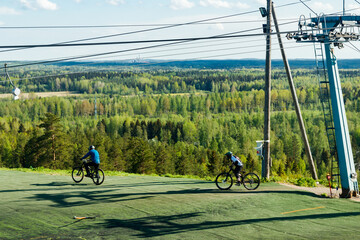 Two young mountain bikers on the hill
