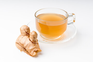 Ginger water and fresh ginger isolated on a white background. Ginger is a useful herb and has medicinal properties.