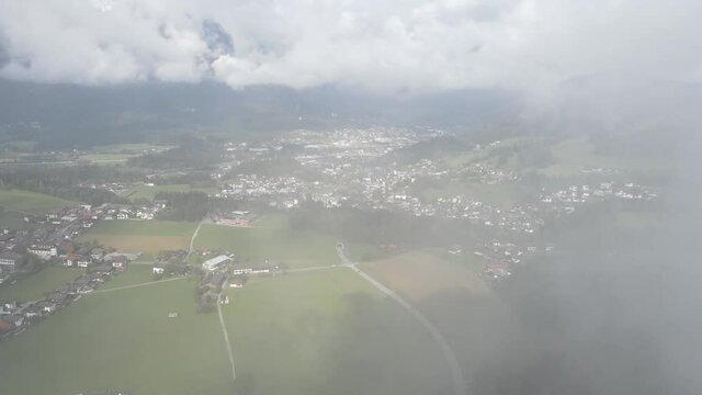 A 4K footage of flying through the clouds above Inntal near Reith im Alpbachtal in Austria